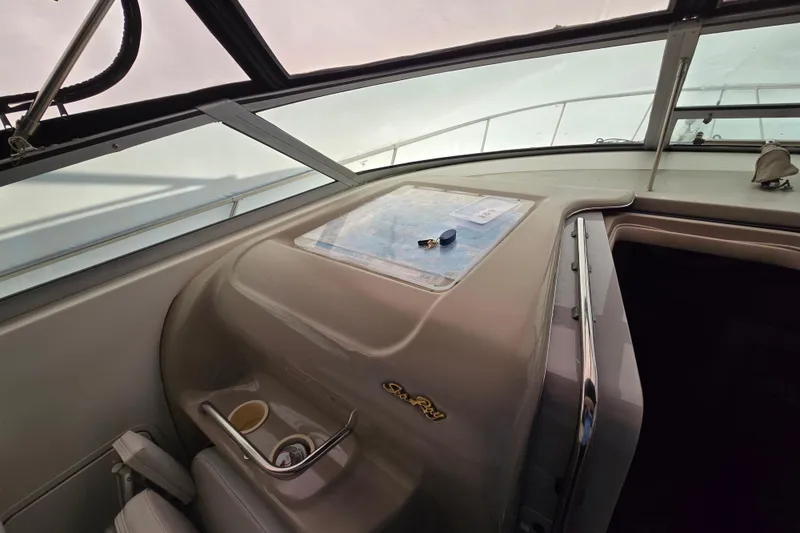 Slide: The Image of Interior view of a 1998 Sea Ray 340 Amberjack boat cockpit with dashboard details. - 37