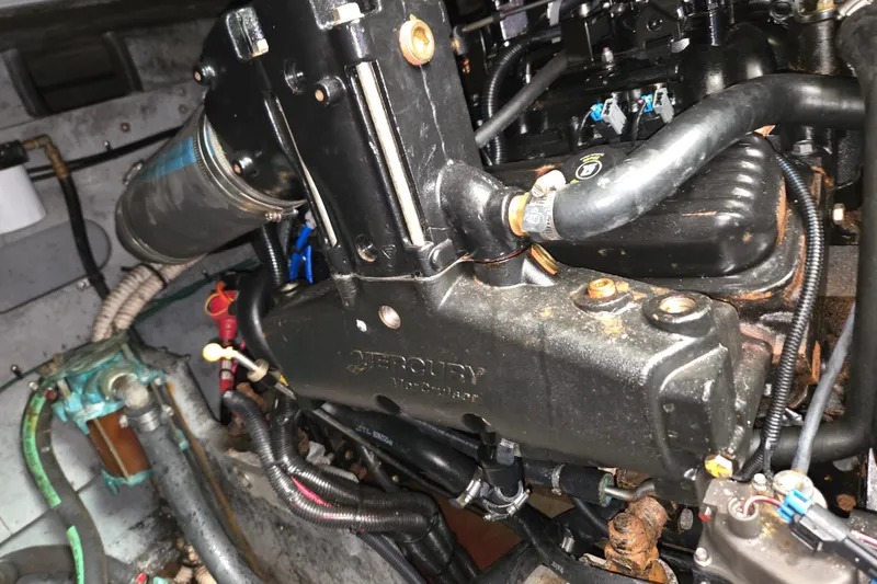 Slide: The Image of Engine compartment of a 1998 Sea Ray 340 Amberjack boat, featuring Mercury components. - 42