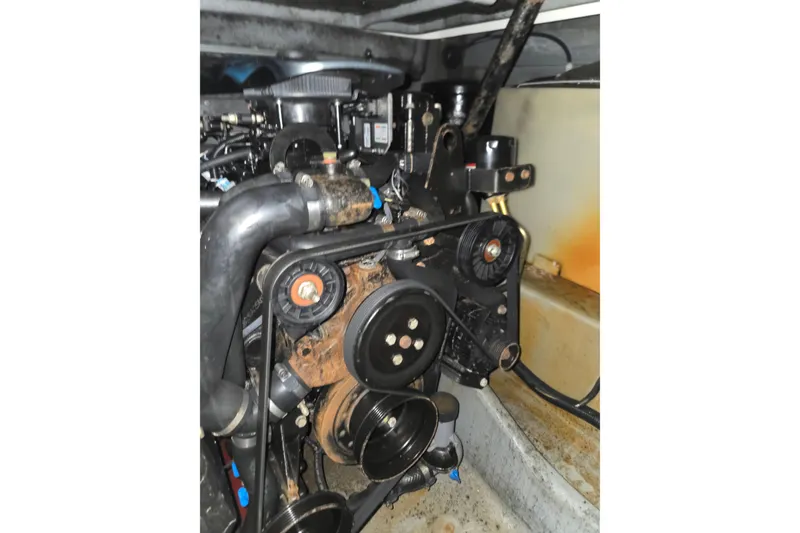 Slide: The Image of Engine compartment of a 1998 Sea Ray 340 Amberjack boat, showing mechanical components. - 44