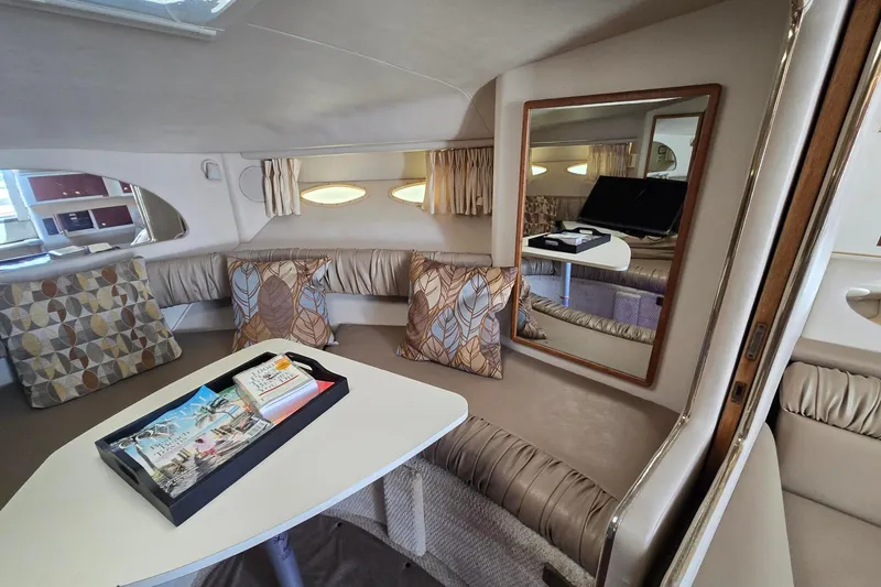 Slide: The Image of Luxurious interior of a 1998 Sea Ray 330 Express yacht with elegant seating and decor. - 27