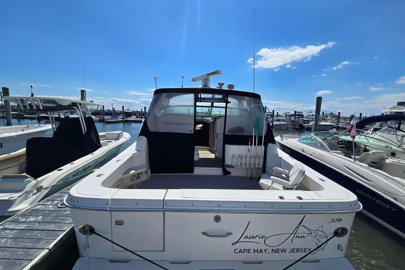 Slide: The Image of 1998 Sea Ray 330 Express docked in Cape May, New Jersey marina. - 3