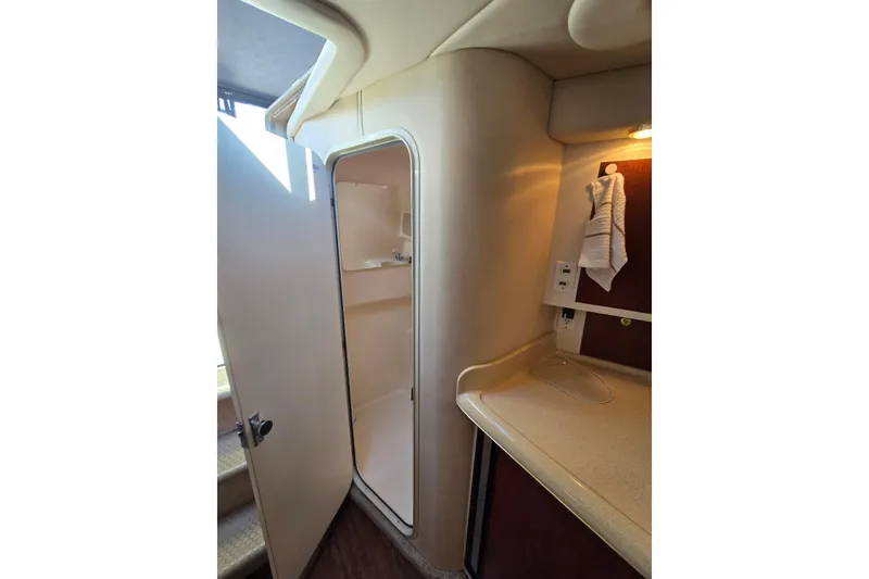 Slide: The Image of Interior of 1998 Sea Ray 330 Express showing bathroom and countertop area. - 33