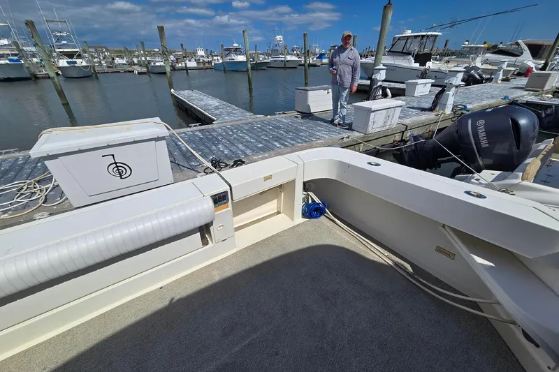 Slide: The Image of 1998 Sea Ray 330 Express docked at marina with clear blue sky. - 42