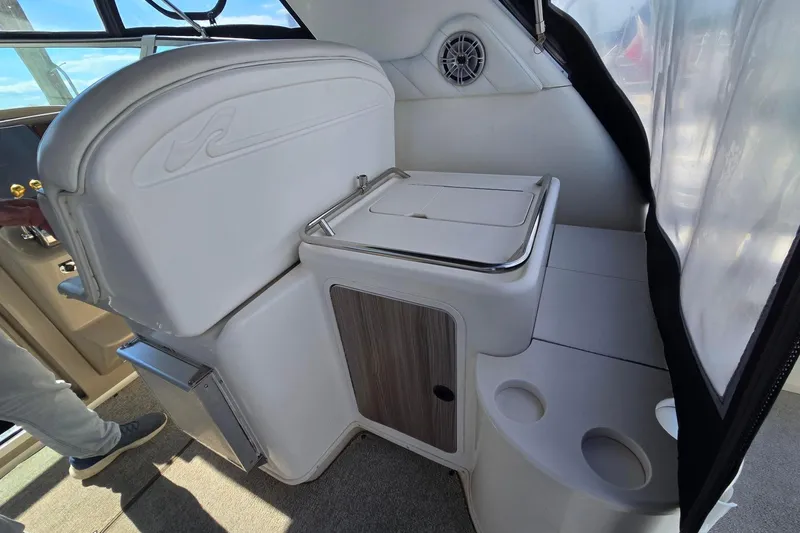 Slide: The Image of 1998 Sea Ray 330 Express boat interior with seating and storage compartments. - 44