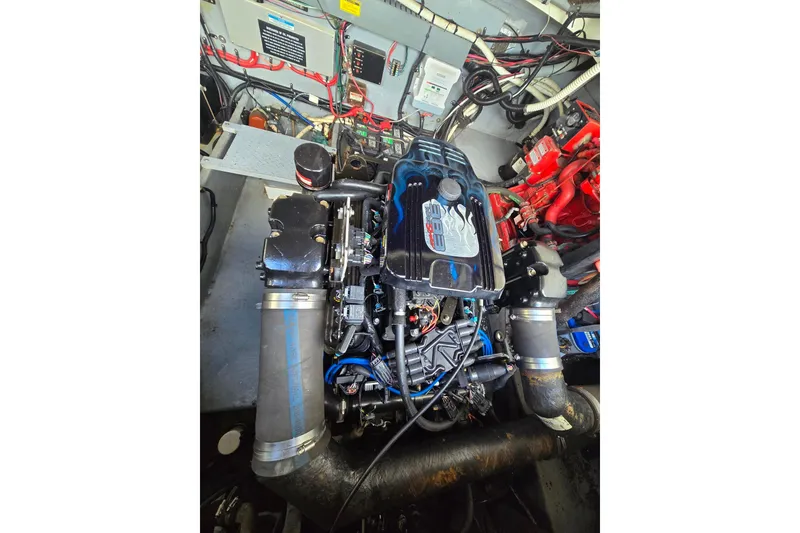 Slide: The Image of Engine compartment of a 1998 Sea Ray 330 Express boat, showcasing detailed components. - 45