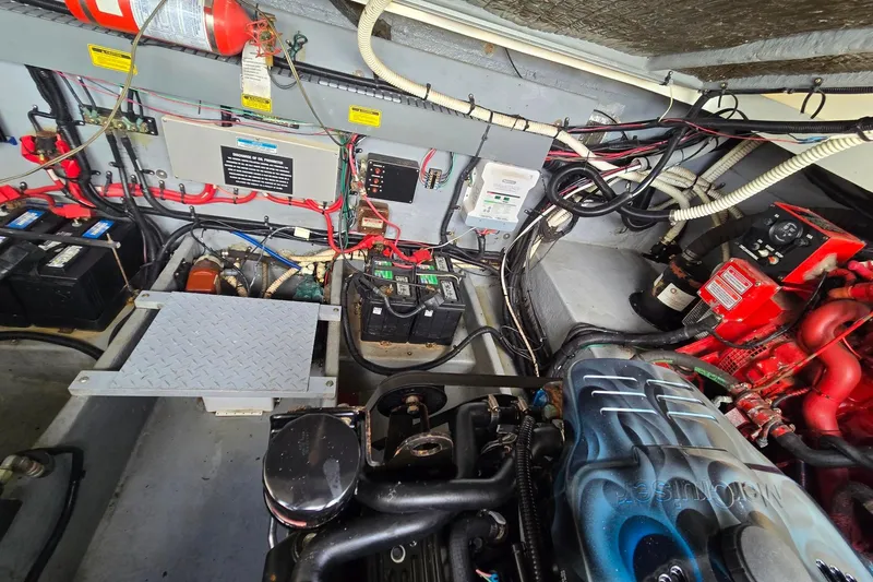 Slide: The Image of Engine room of a 1998 Sea Ray 330 Express, showcasing wiring and components. - 50
