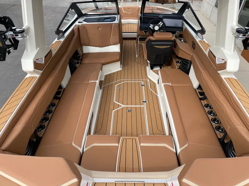 Slide: The Image of Interior of 2026 Nautique G25 with luxurious brown seating. - 5