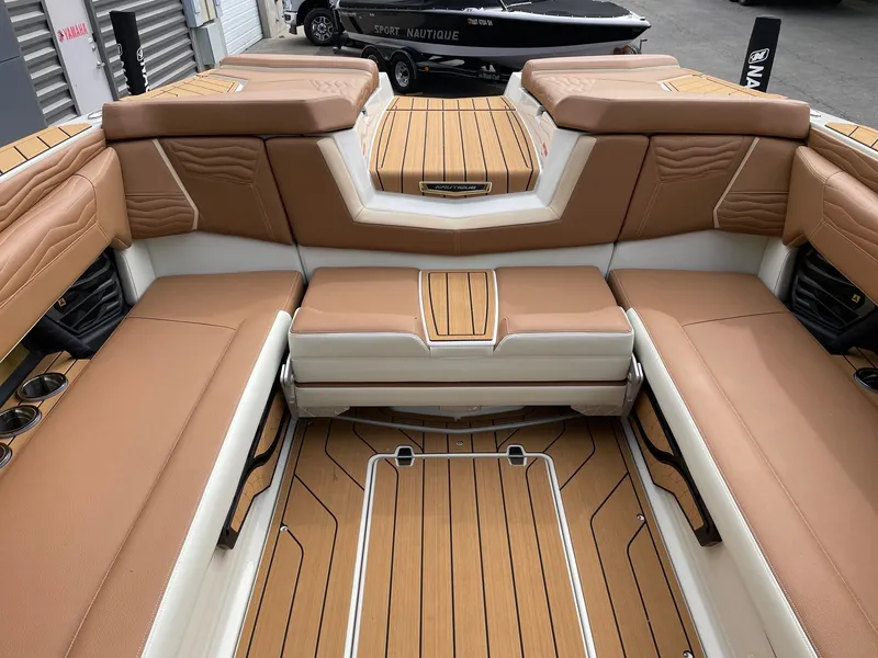Slide: The Image of Interior of 2026 Nautique G25 with luxurious leather seating. - 8