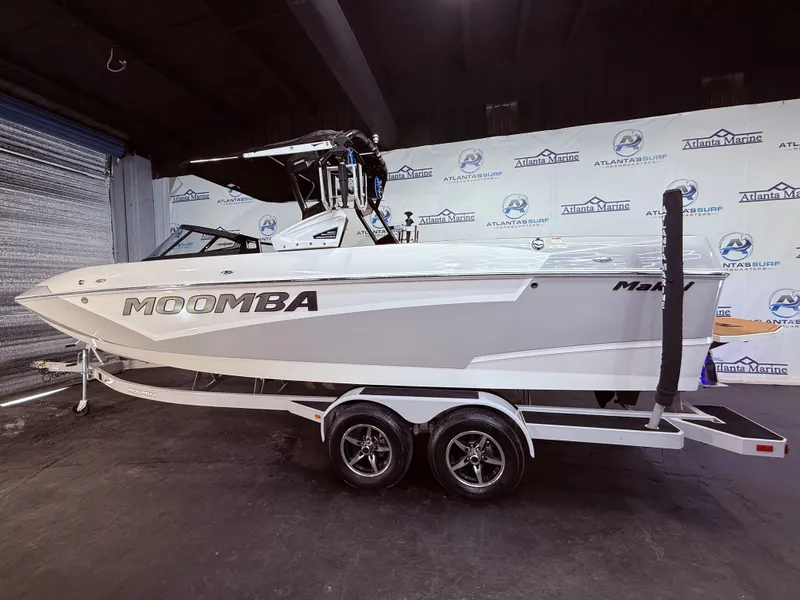 Slide: The Image of 2019 Moomba Makai boat displayed in a showroom. - 10