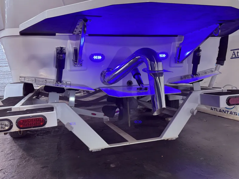 Slide: The Image of Rear view of a 2019 Moomba Makai boat with blue lighting. - 11
