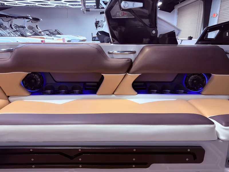 Slide: The Image of Interior of a 2019 Moomba Makai boat with speakers and blue lighting. - 18