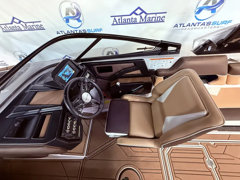 Slide: The Image of Interior of a 2019 Moomba Makai boat with steering console. - 21