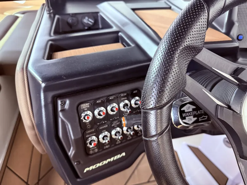Slide: The Image of Dashboard of a 2019 Moomba Makai boat with controls and switches. - 22
