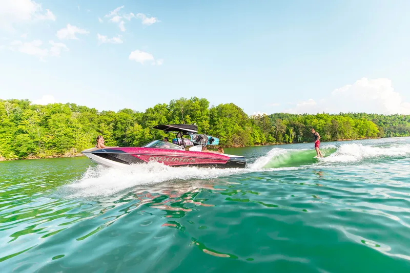 Slide: The Image of 2019 Moomba Makai boat enjoying watersports on a lake. - 36