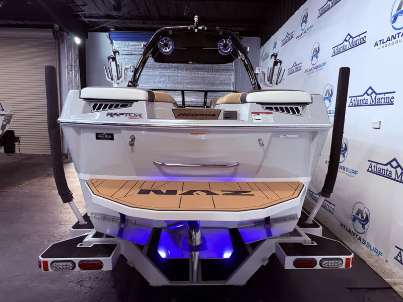 Slide: The Image of Rear view of a 2019 Moomba Makai boat in showroom. - 7