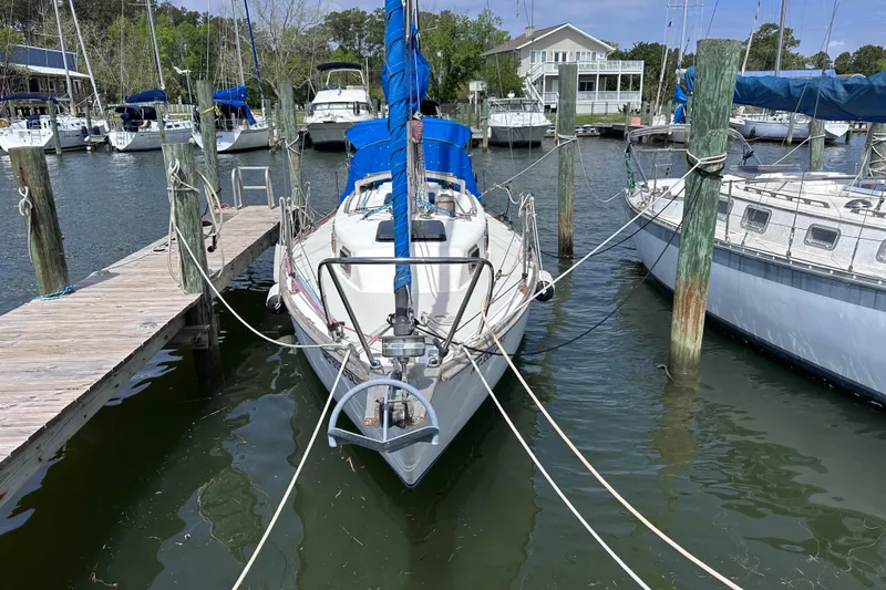 The Image of 1975 Cape Dory 28 sailboat docked at a marina with other boats. - 1