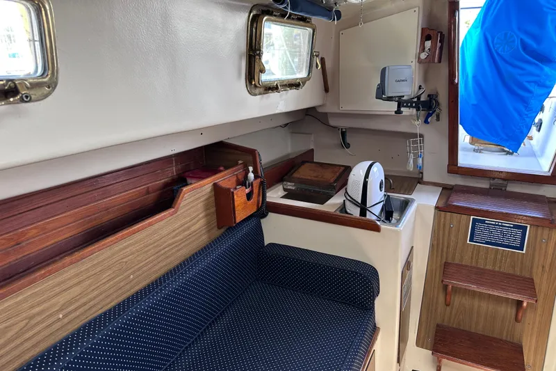 Slide: The Image of Interior of a 1975 Cape Dory 28 sailboat with seating and navigation equipment. - 20
