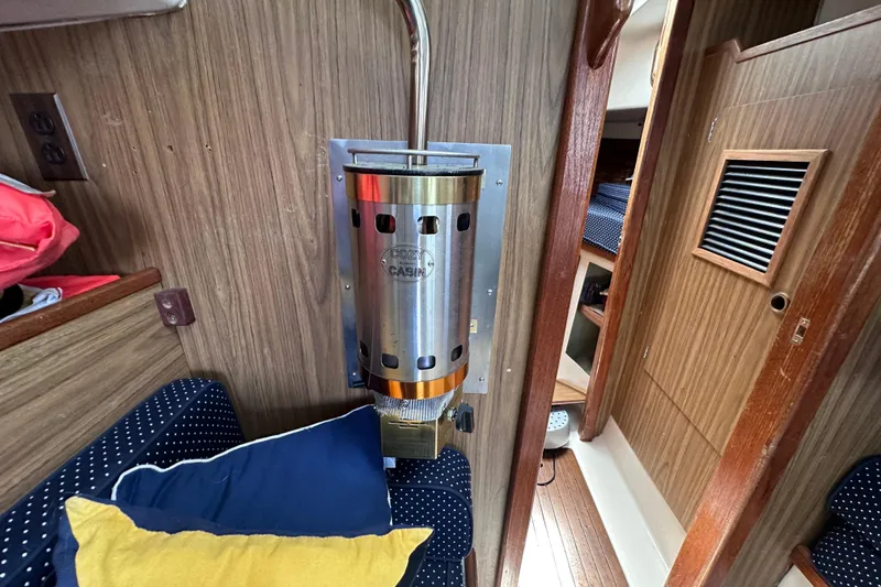 Slide: The Image of Cozy cabin interior of a 1975 Cape Dory 28 sailboat with heater and cushions. - 33