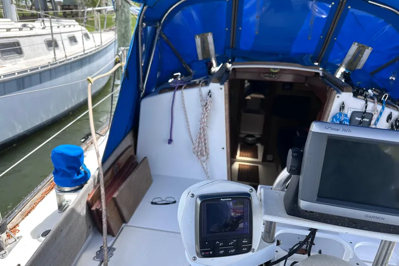 Slide: The Image of Cockpit view of a 1975 Cape Dory 28 sailboat with navigation equipment. - 9