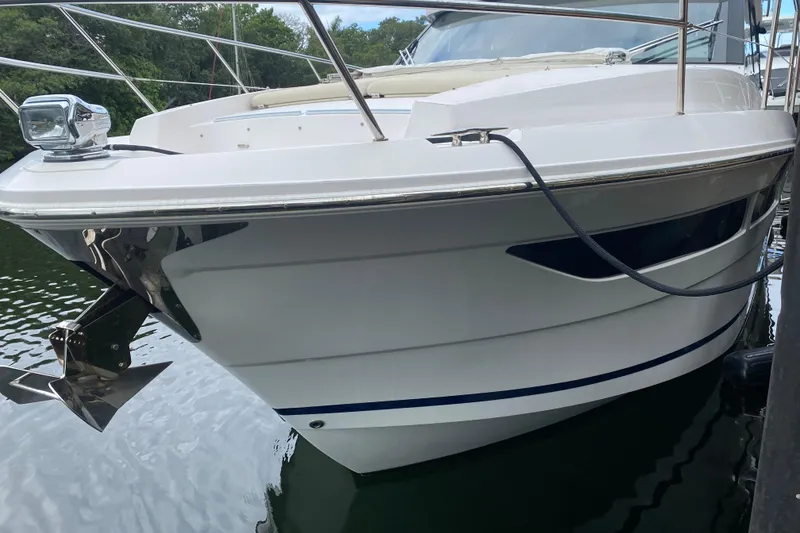 Slide: The Image of 2021 Regal 38 XO yacht docked, showcasing sleek design and modern features. - 23