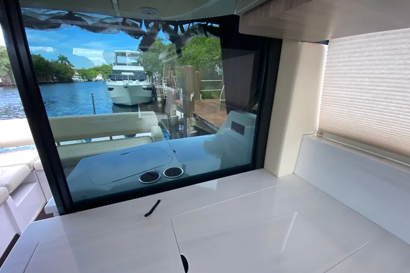 Slide: The Image of Interior view of 2021 Regal 38 XO yacht with dockside scenery. - 27