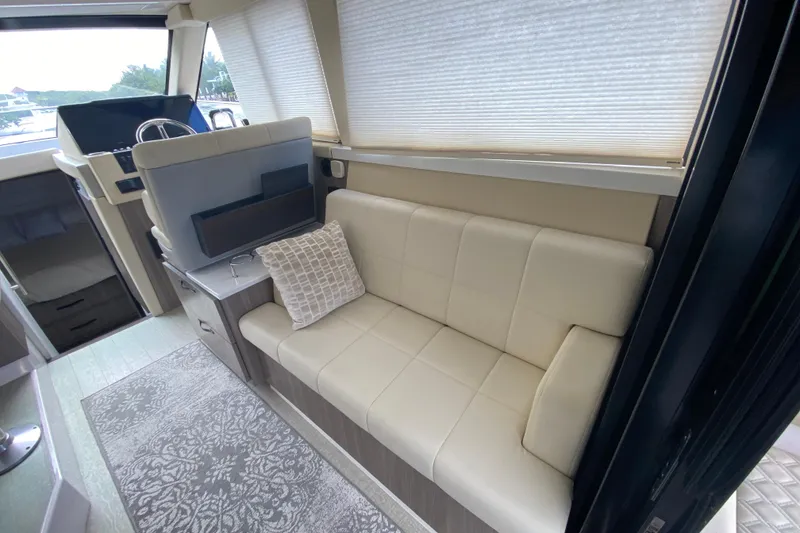 Slide: The Image of Luxurious interior of 2021 Regal 38 XO yacht with cream leather seating and modern decor. - 31