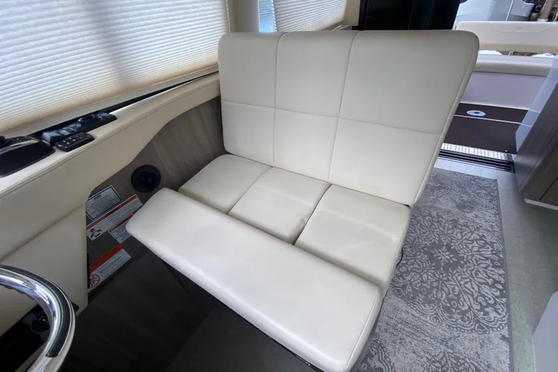 Slide: The Image of Luxurious interior seating of 2021 Regal 38 XO yacht with elegant white upholstery. - 34
