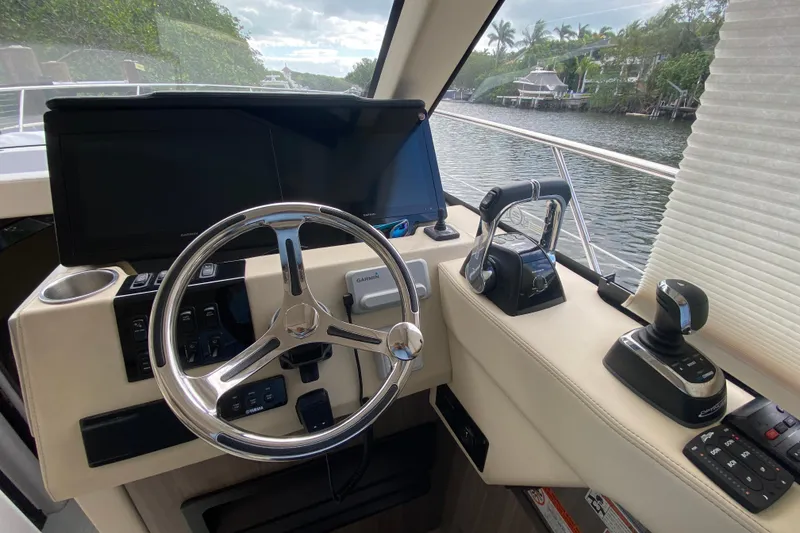 Slide: The Image of Helm of 2021 Regal 38 XO yacht with modern controls and navigation system. - 35