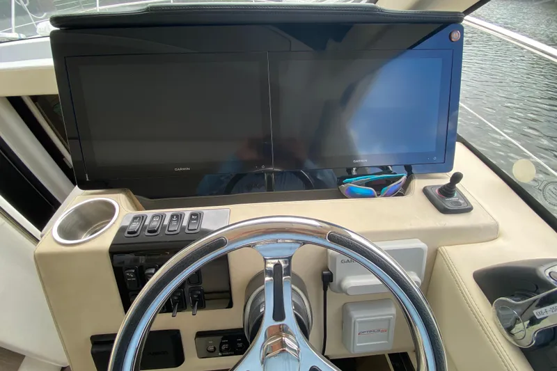 Slide: The Image of Helm of 2021 Regal 38 XO yacht with dual Garmin displays and joystick control. - 37