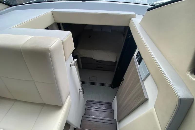 Slide: The Image of Interior view of 2021 Regal 38 XO yacht cabin with stairs and seating. - 39