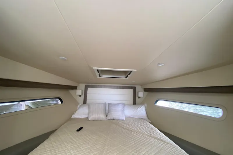 Slide: The Image of Luxurious cabin interior of 2021 Regal 38 XO yacht with cozy bedding. - 43