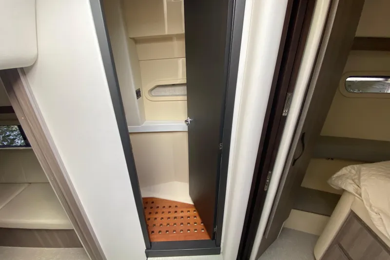 Slide: The Image of Interior of 2021 Regal 38 XO yacht featuring a compact cabin space. - 44