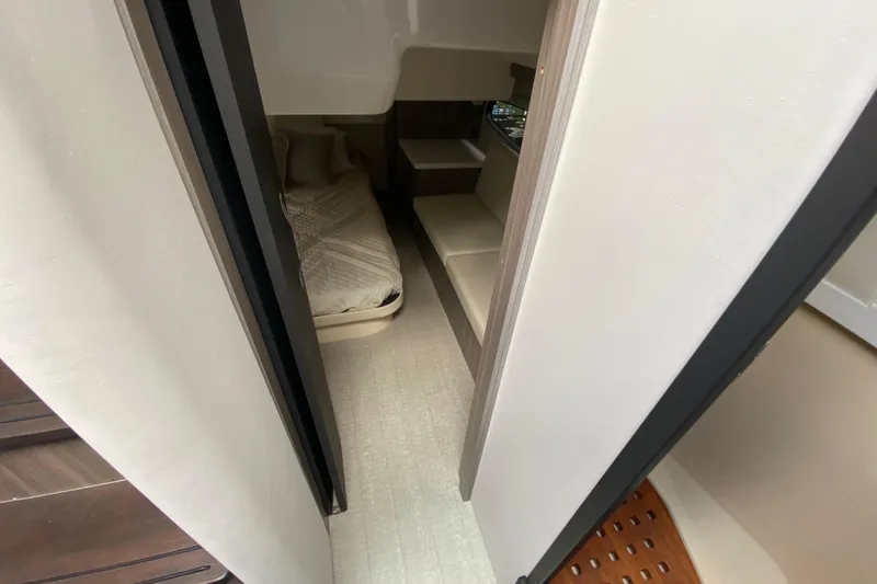 Slide: The Image of Interior cabin view of 2021 Regal 38 XO yacht, featuring a cozy bed and modern design. - 46