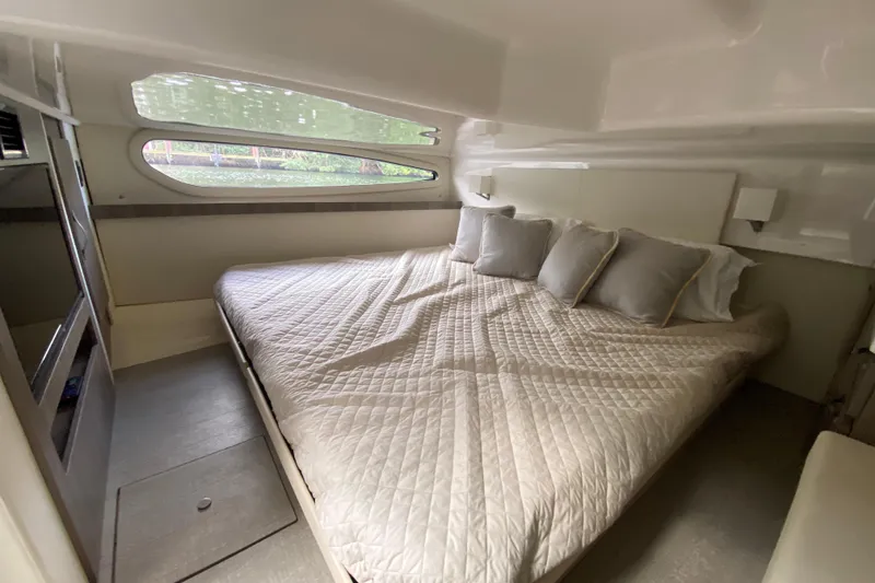 Slide: The Image of Luxurious cabin interior of 2021 Regal 38 XO yacht with comfortable bedding. - 47