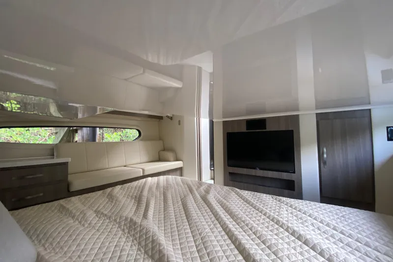 Slide: The Image of Luxurious interior of 2021 Regal 38 XO yacht with modern furnishings and TV. - 48