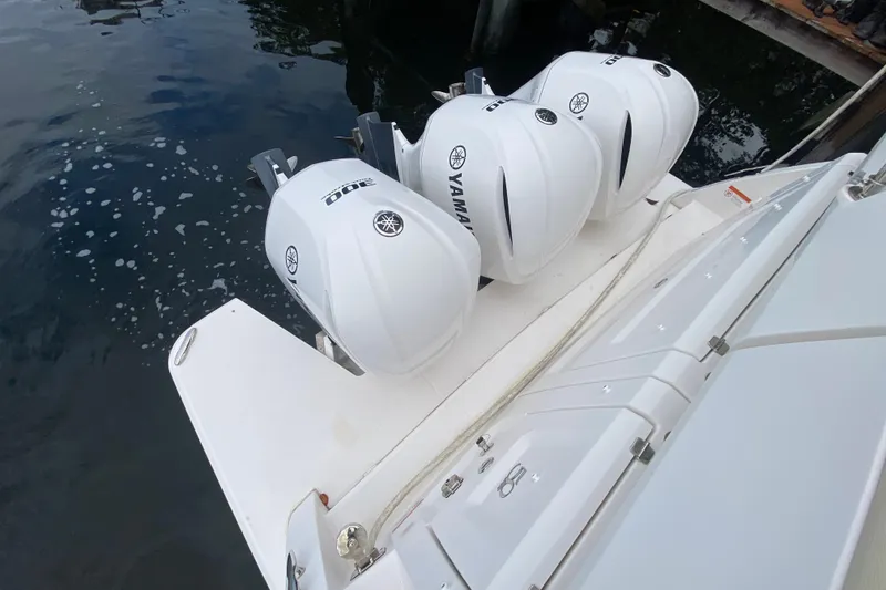 Slide: The Image of Regal 38 XO 2021 with three Yamaha outboard engines. - 49