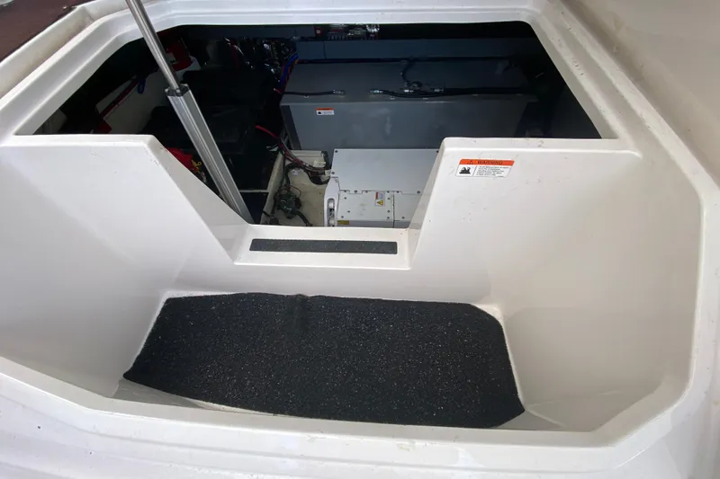 Slide: The Image of Engine compartment of a 2021 Regal 38 XO boat, showcasing interior components and structure. - 53