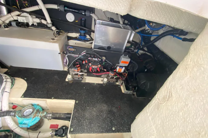 Slide: The Image of Engine compartment of a 2021 Regal 38 XO boat, showcasing wiring and components. - 55
