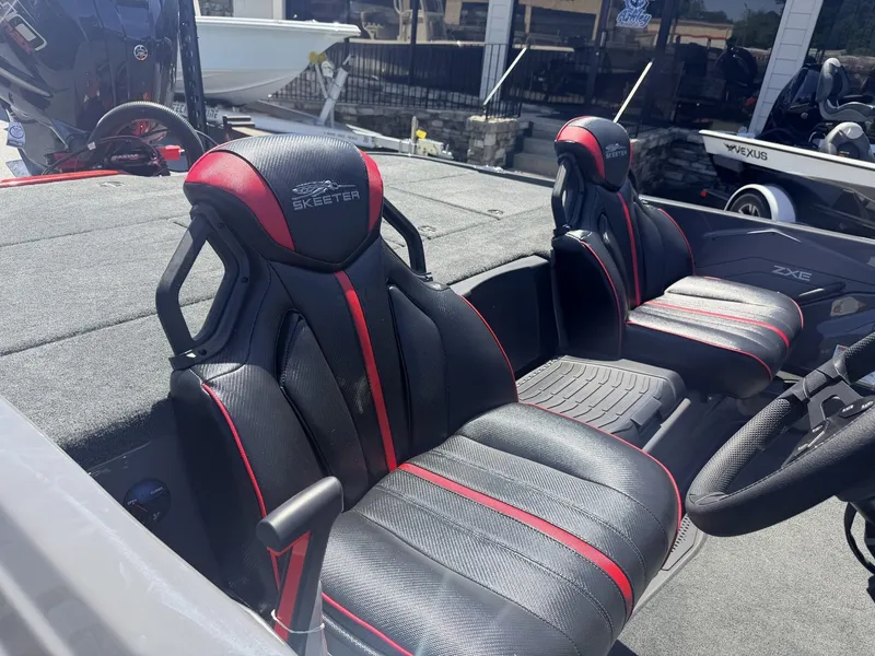 Slide: The Image of 2026 Skeeter ZXE21 boat with special seating and color options. - 13