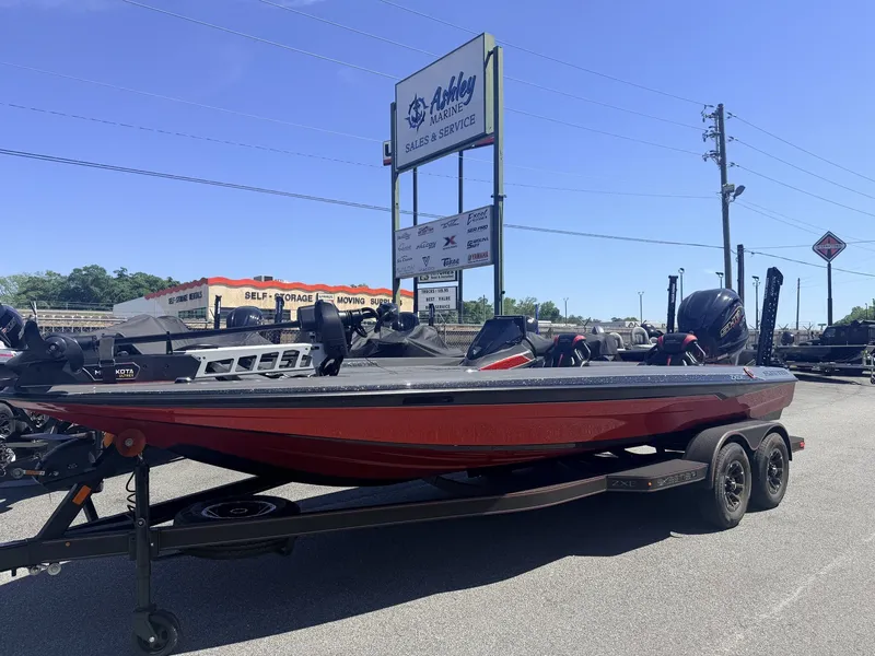 Slide: The Image of 2026 Skeeter ZXE21 boat in special color option at a marine dealership. - 7