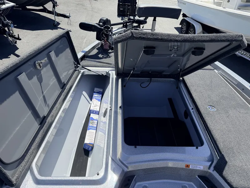 Slide: The Image of iKon Victory Series VLX20 boat with open storage compartments, year 2026. - 5