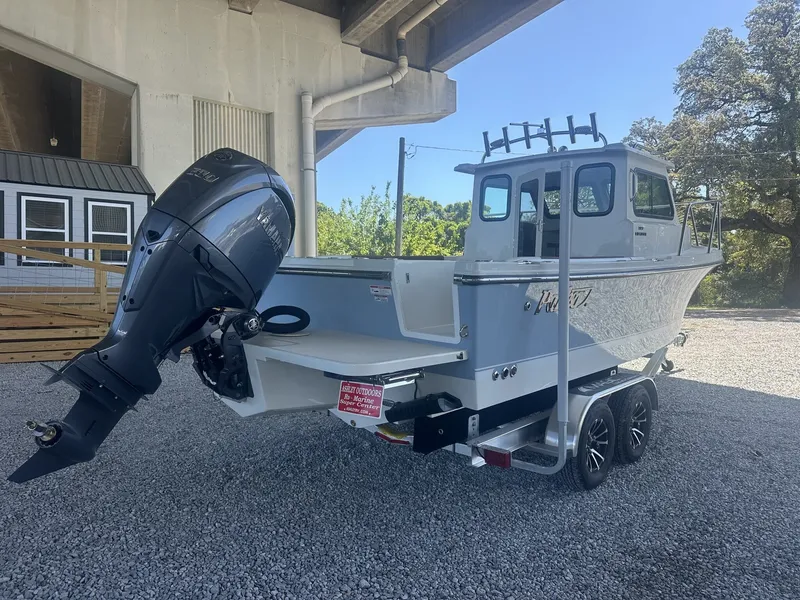 Slide: The Image of Parker 227 Explorer boat 2026 with trailer under bridge. - 6