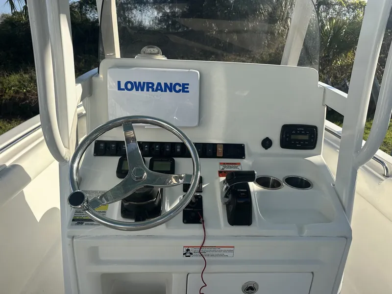 Slide: The Image of Dashboard of Sea Hunt Ultra 235 SE boat, model year 2023. - 8