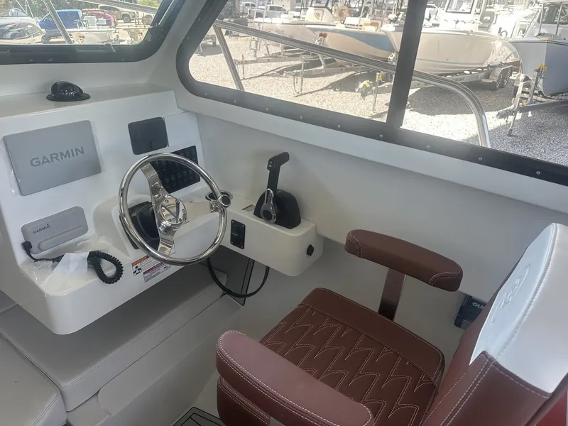 Slide: The Image of Interior of 2026 Parker 227 Explorer with steering console. - 11