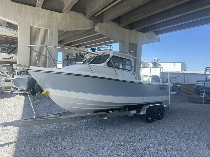 Slide: The Image of Parker 227 Explorer boat 2026 under bridge on trailer. - 4