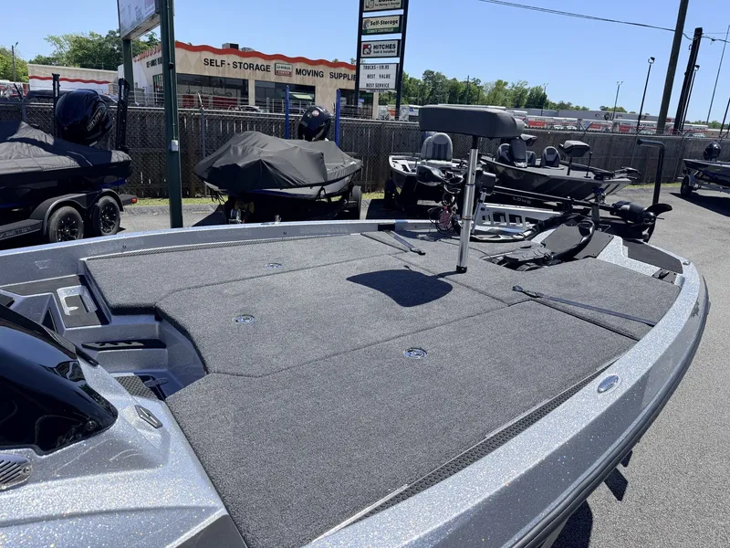 Slide: The Image of iKon Victory Series VLX20 boat, 2026 model, displayed in parking lot. - 13