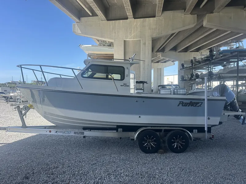 Slide: The Image of Parker 227 Explorer boat 2026 parked under bridge. - 9