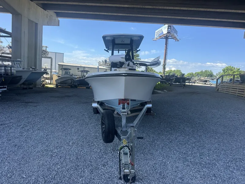 Slide: The Image of 2026 Blazer Bay 2440 boat on trailer under bridge. - 3