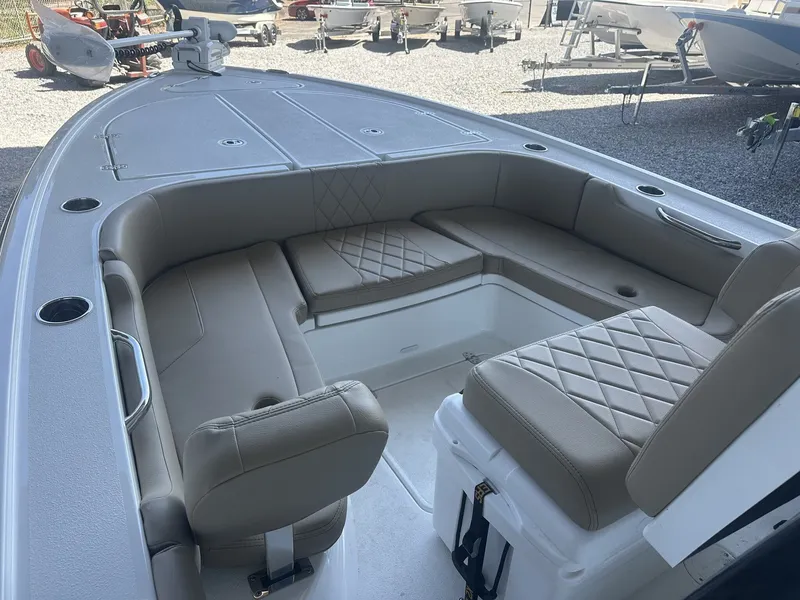 Slide: The Image of Interior of Blazer Bay 2440 boat, 2026 model, featuring cushioned seating. - 4