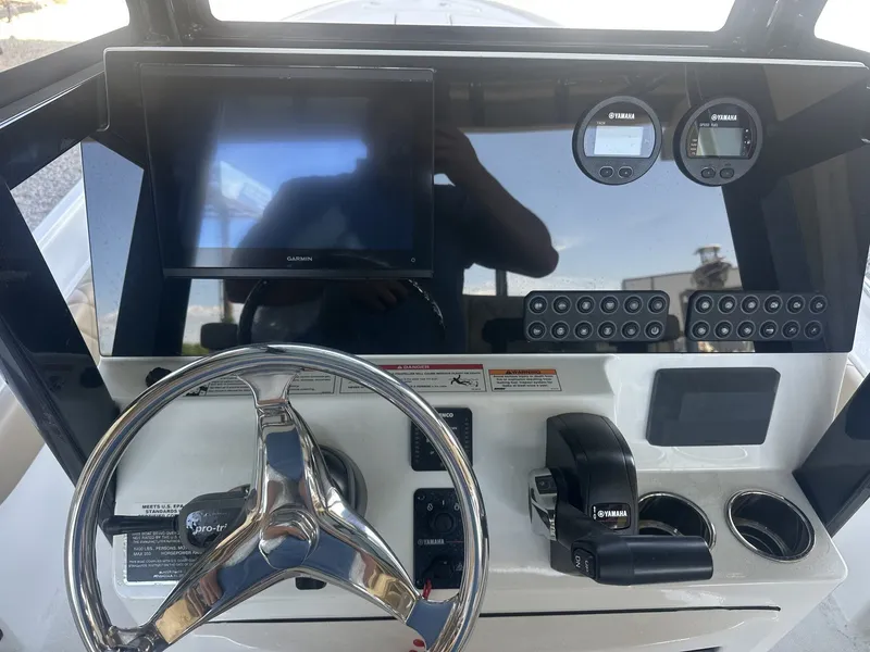 Slide: The Image of Blazer Bay 2440 2026 boat console with Garmin display and Yamaha controls. - 9